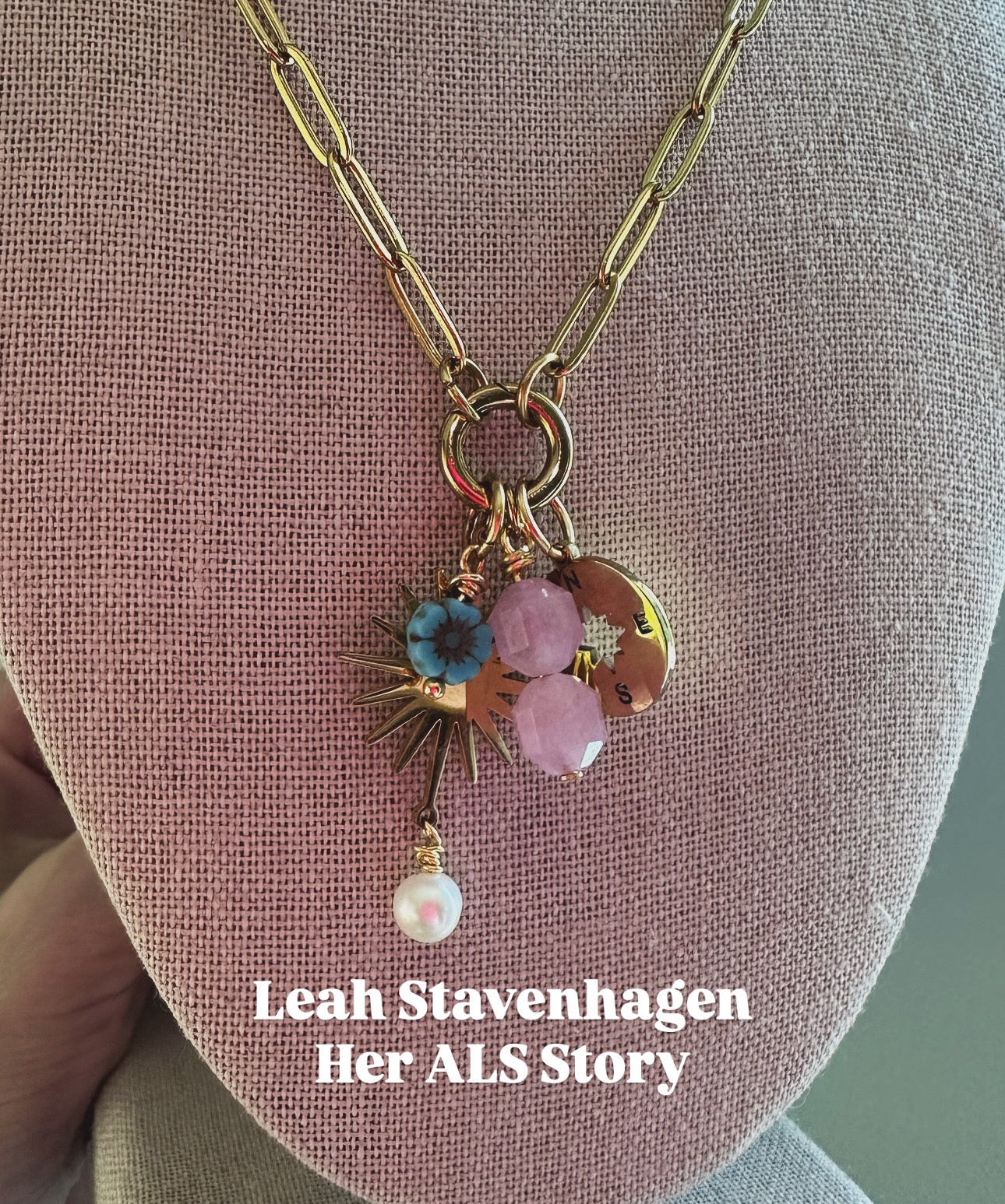 Necklace with floral charm on a mannequin bust, featuring 'Leah Stavenhagen Her ALS Story'.