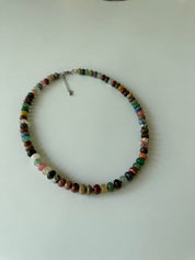 Multicolored beaded necklace on a white background