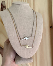 silver and gold lightning bolt necklaces
